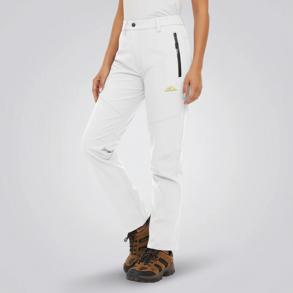 Stylish women's insulated waterproof pants for winter outdoor activities & travel.