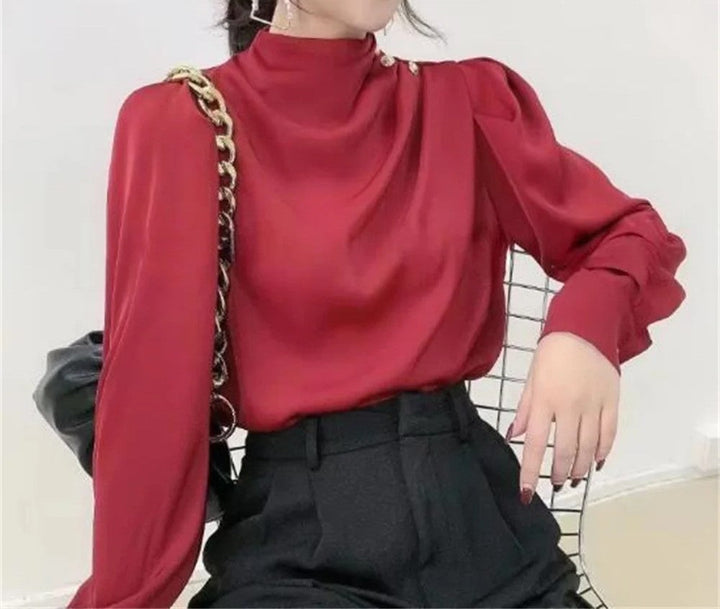 Elegant women's mock neck long sleeve blouse, featuring flattering ruching & exquisite gold buttons. Office to evening.