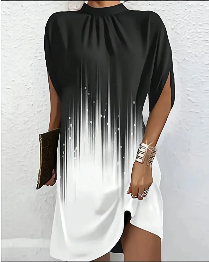 Comfortable and stylish women's mini dress with a mock neck, flowing cape sleeves, and modern design.