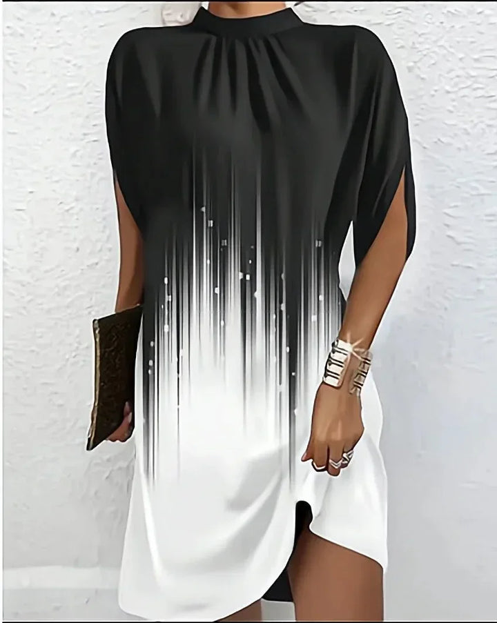 Comfortable and stylish women's mini dress with a mock neck, flowing cape sleeves, and modern design.