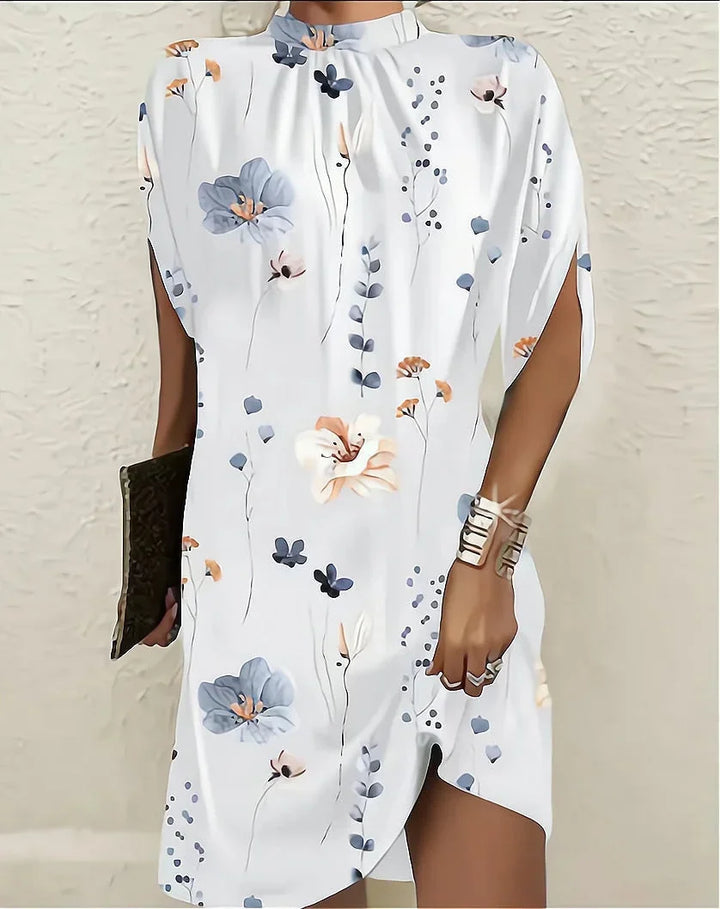 Chic women's party mini dress, featuring a stylish mock neck and dramatic cape sleeves.