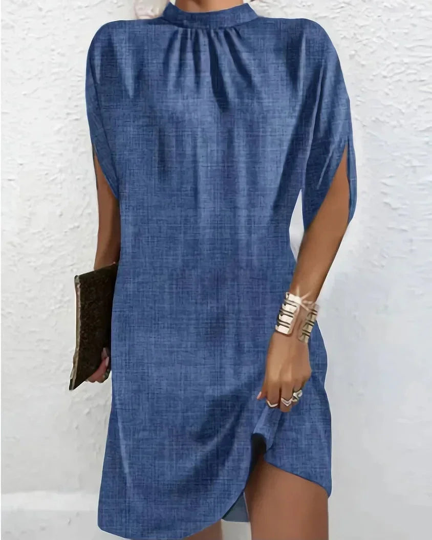 Fashionable women's mini dress, contemporary mock neck, chic cape sleeves, and modern style.