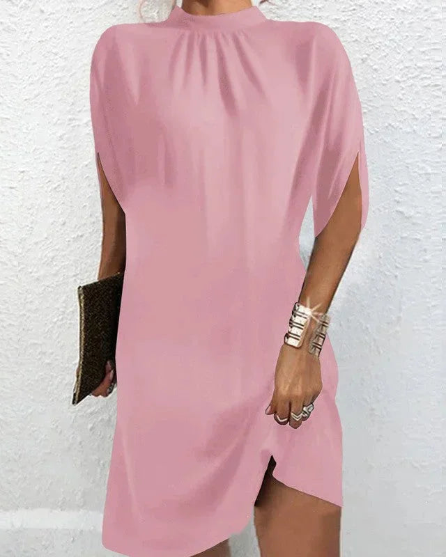 Effortless chic women's mini dress with a mock neck, elegant cape sleeves, ideal for any event.