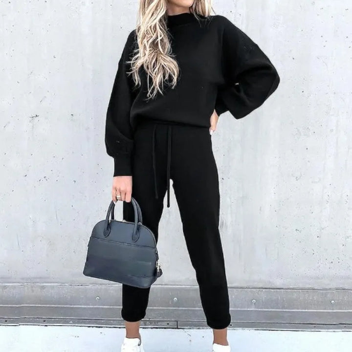Stylish women's two-piece set: mock neck top, balloon sleeves, and drawstring wide-leg pants.