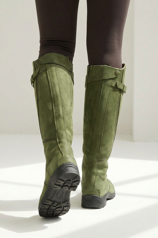 Front view: Stylish women's modern knee-high boots, featuring a stable sole & all-day comfort. Great for urban chic.
