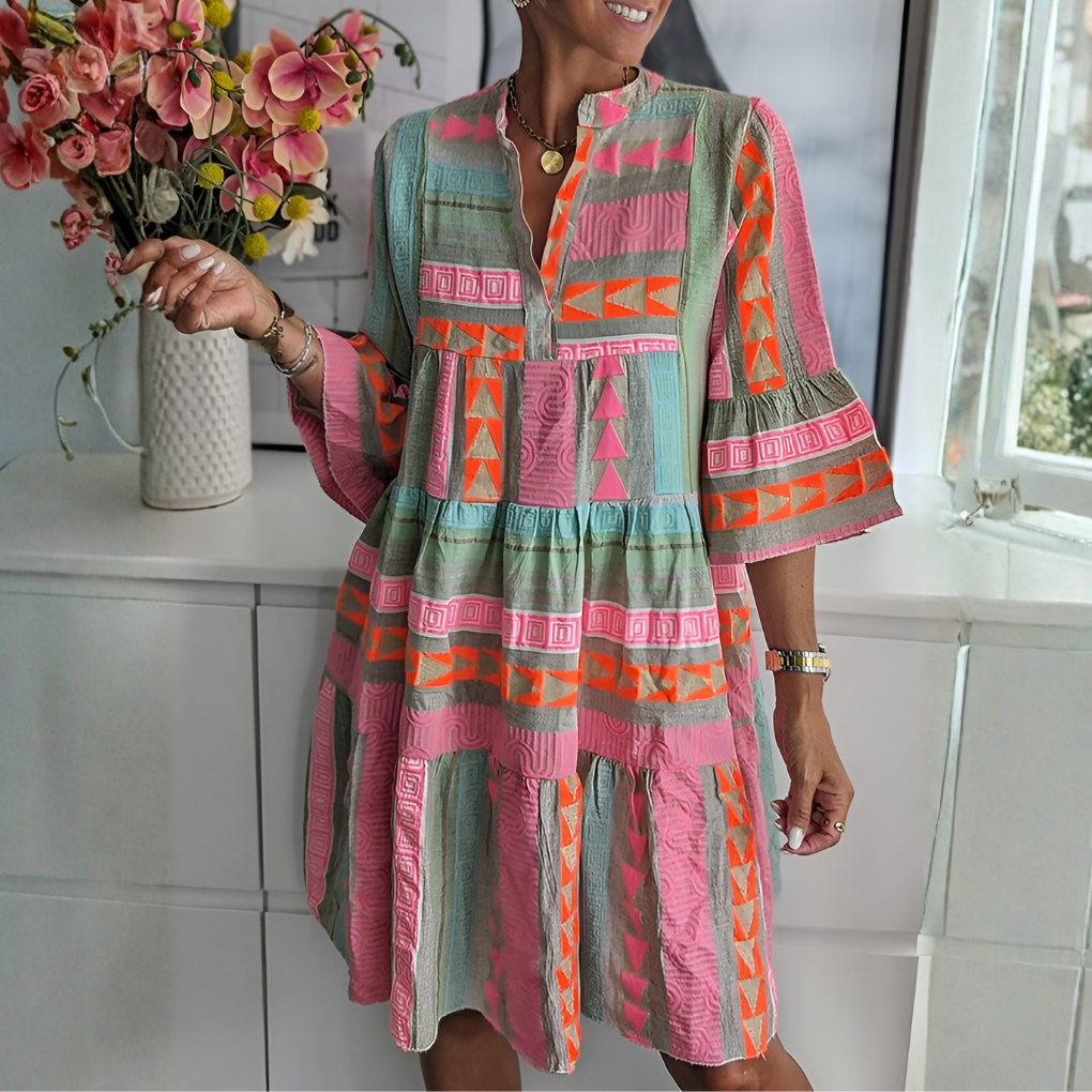 Women's multi-color boho midi dress with geometric print, loose fit, V-neck, and three-quarter sleeves. Perfect for summer.