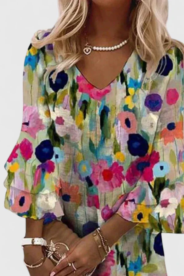 Vibrant floral pattern mini dress for women. Stylish v-neck and ruffled sleeves, ideal short summer casual fashion.