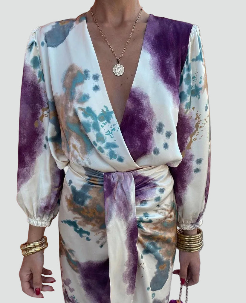 Vibrant tie-dye women's midi wrap dress, featuring 3/4 sleeves & a flattering V-neck. Ideal for elegant parties.