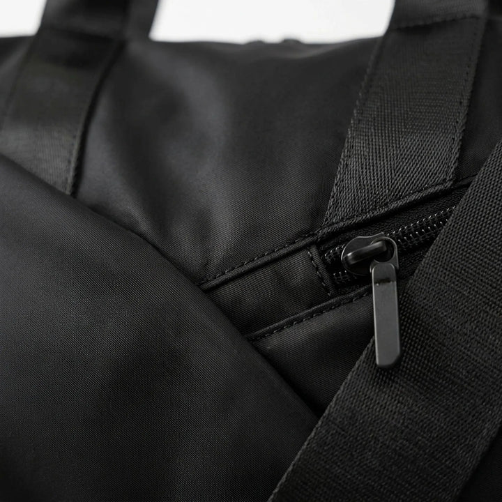 Spacious women's travel duffel bag for gym & weekend. Features multiple pockets for easy organization & essentials.
