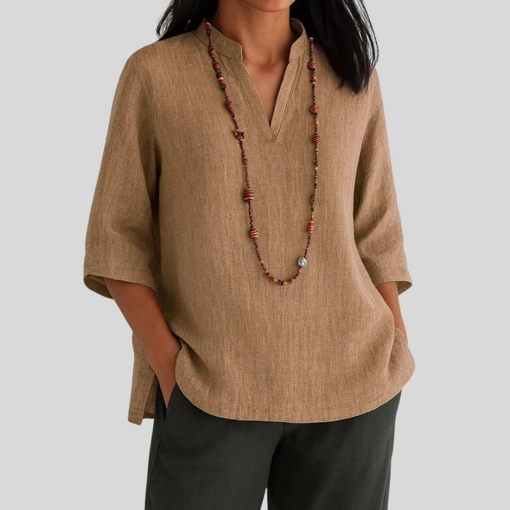 Model wearing a comfortable, loose fit Women's Nara Blouse. Stylish & airy summer top, ideal for casual wear.