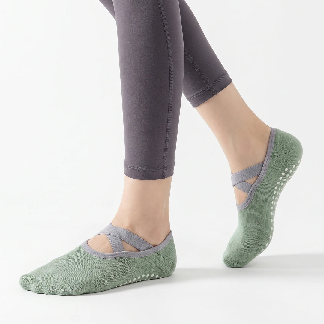 Pair of women's yoga grip socks with non-slip sole for studio fitness, dance, and pilates. Comfortable.