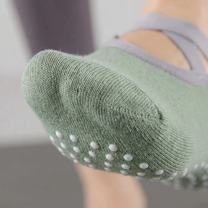 Black women's barre socks with non-slip grips, ideal for pilates, yoga, and studio fitness classes.
