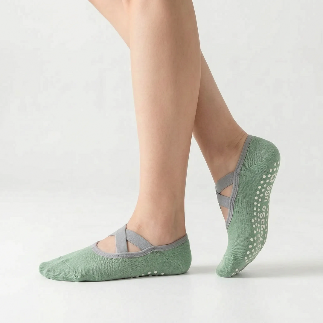 Close-up of women's non-slip grip socks for studio workouts, yoga, and barre. Enhanced traction activewear.