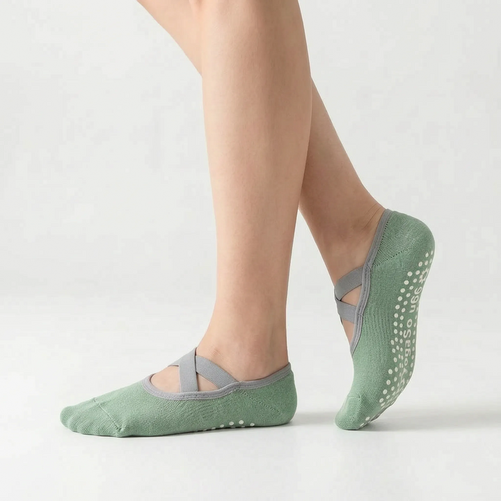 Close-up of women's non-slip grip socks for studio workouts, yoga, and barre. Enhanced traction activewear.