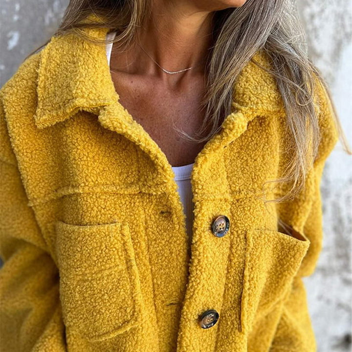 Elegant women's long-sleeve autumn coat, showcasing a stylish notch collar and functional buttons.