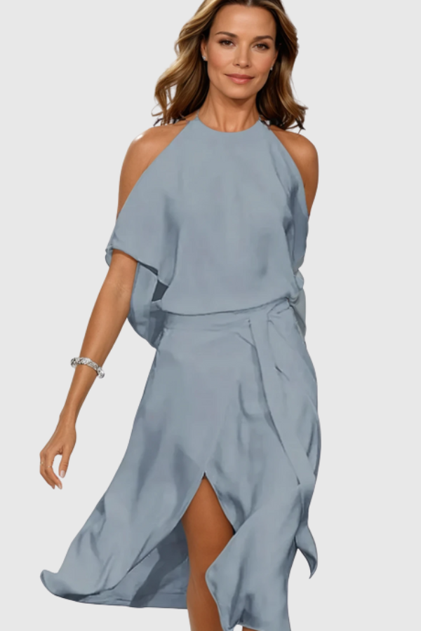 Chic women's off-shoulder midi dress with an asymmetric hem for elegant evenings. Modern, sophisticated party fashion.