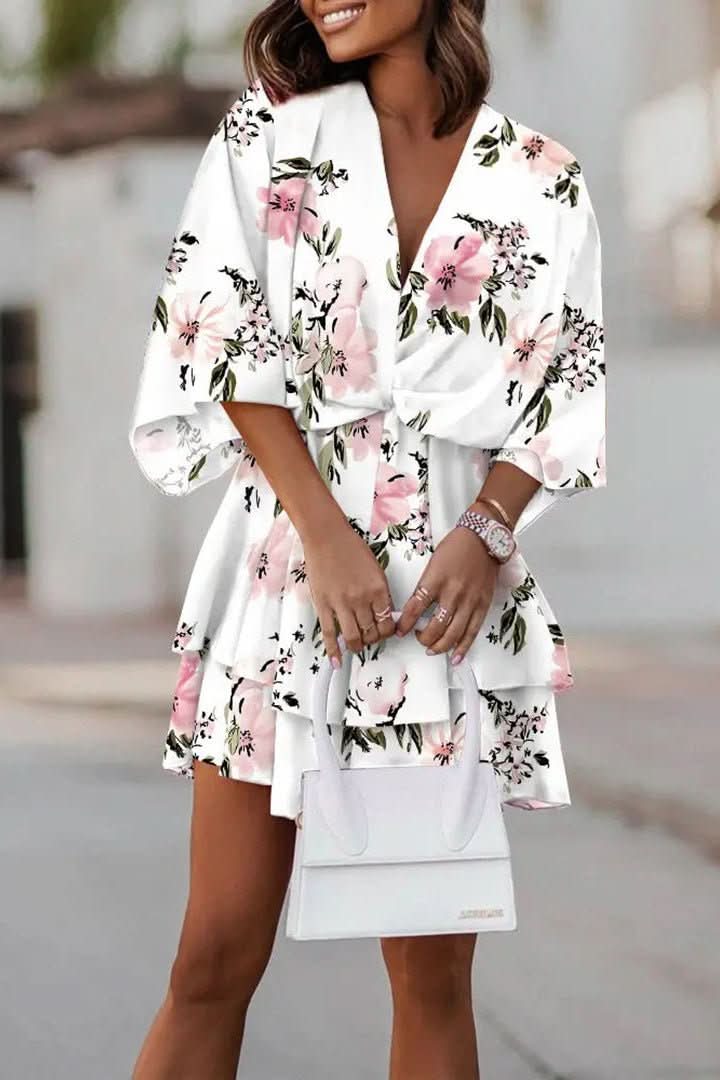 Elegant women's off-shoulder bohemian mini dress, short, flowy summer style, perfect for casual occasions.