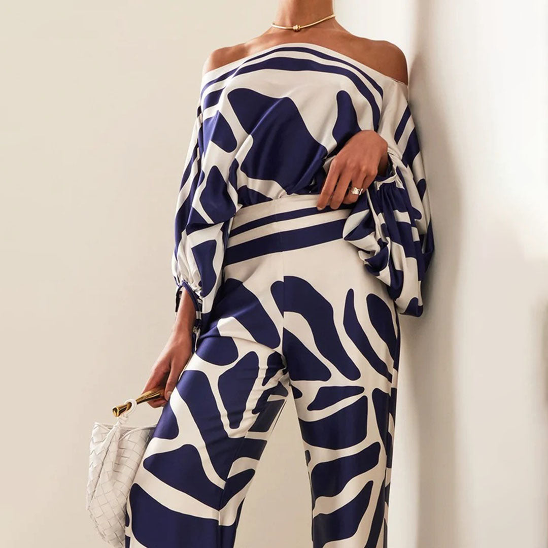 Close-up of the vibrant print on a women's off-shoulder two-piece summer set, stylish design.