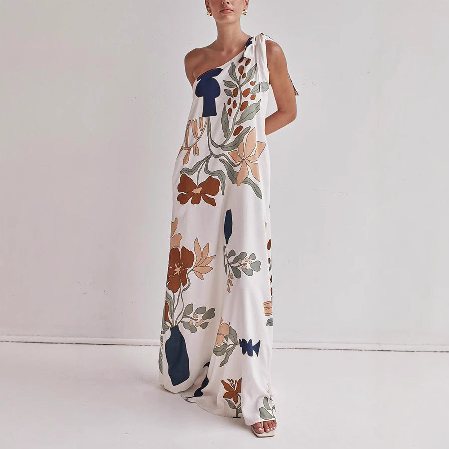 Women's one-shoulder floral maxi dress in apricot. Elegant long gown perfect for summer casual or semi-formal events.