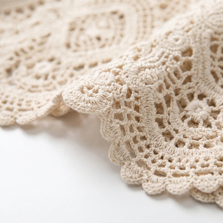 Stylish open-front white crochet style cardigan for women, a lightweight top for casual summer bohemian outfits.