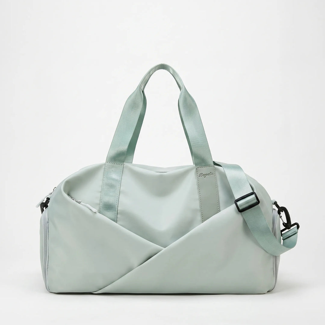 Spacious women's nylon gym duffel with multiple compartments for organized fitness and workout essentials.
