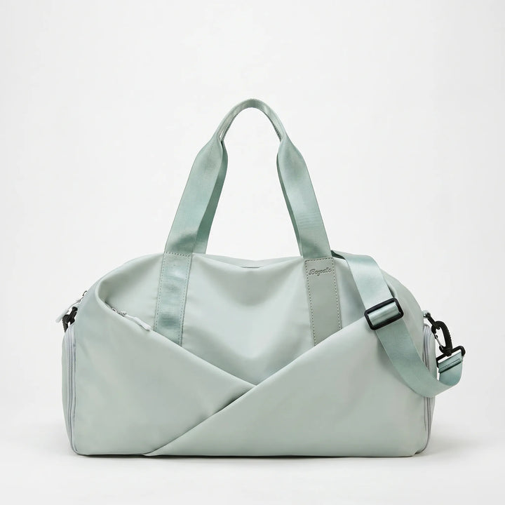 Spacious women's nylon gym duffel with multiple compartments for organized fitness and workout essentials.