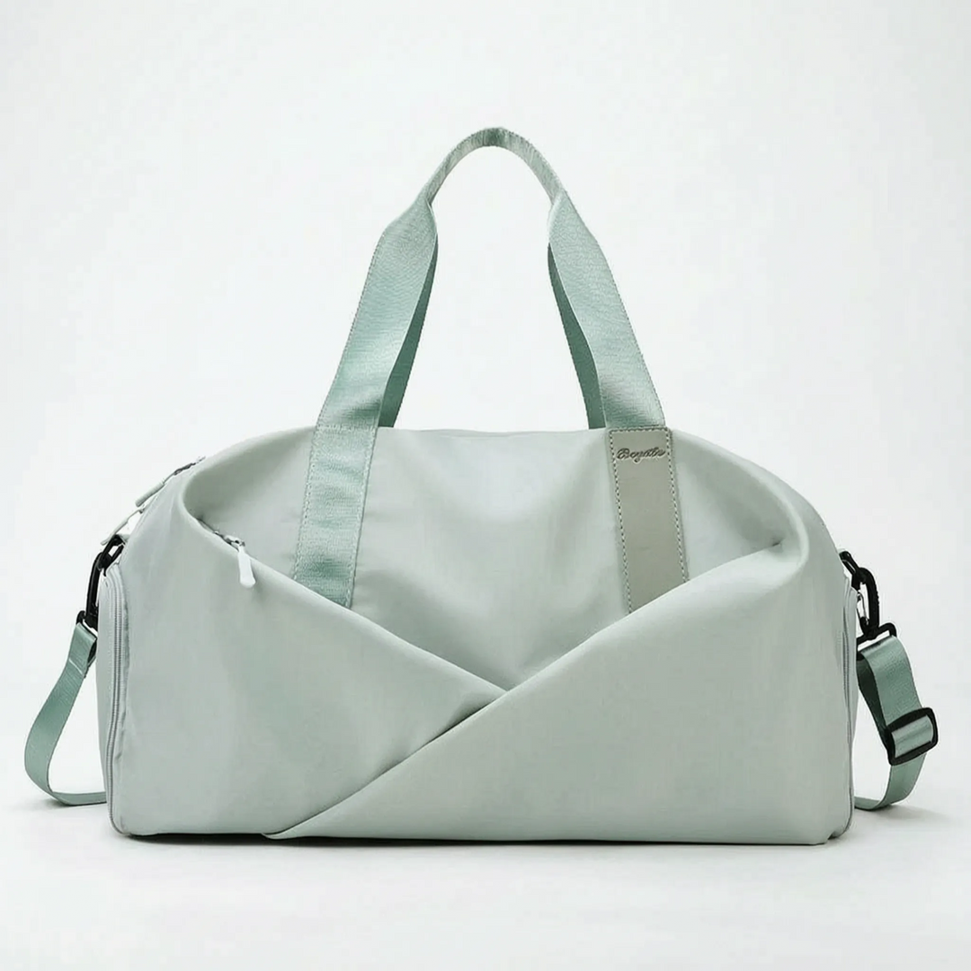 Large women's organized duffel bag, ideal for carrying fitness, workout, and sports essentials with ease.