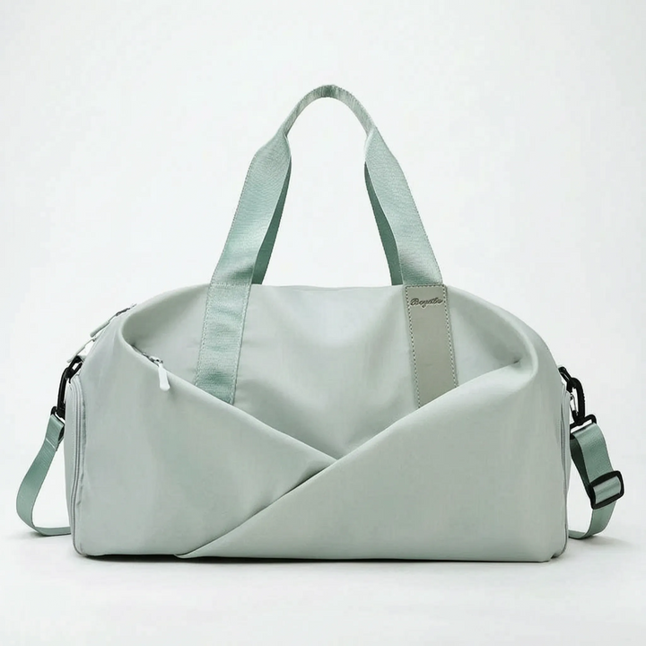 Large women's organized duffel bag, ideal for carrying fitness, workout, and sports essentials with ease.
