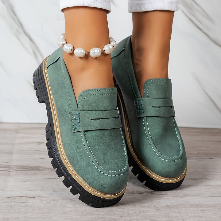 Women's orthopaedic loafers designed for plantar fasciitis relief, featuring a wide toe box.
