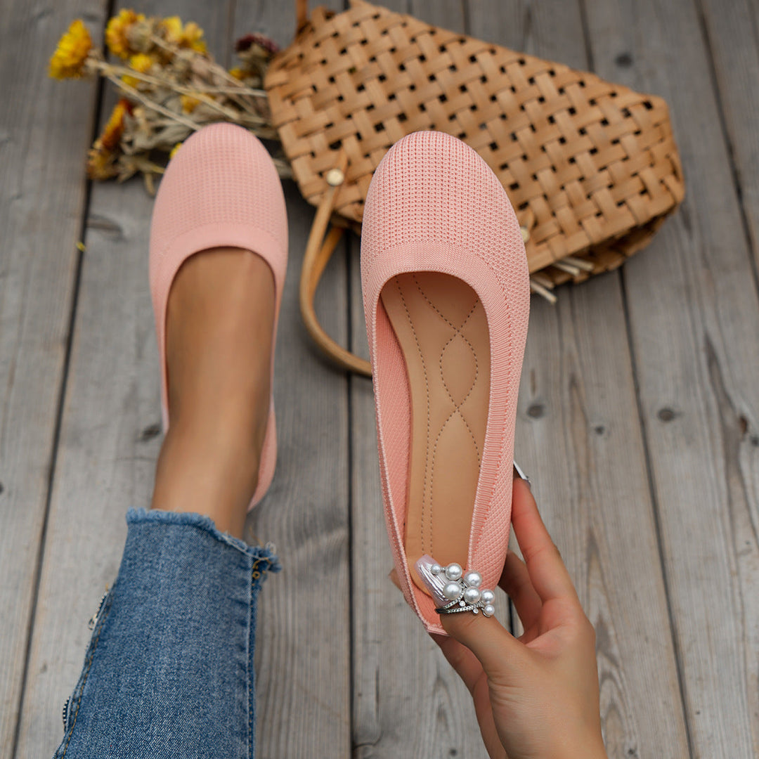 Women's pain relief orthopedic flats, classic slip-on design for elegant office wear.