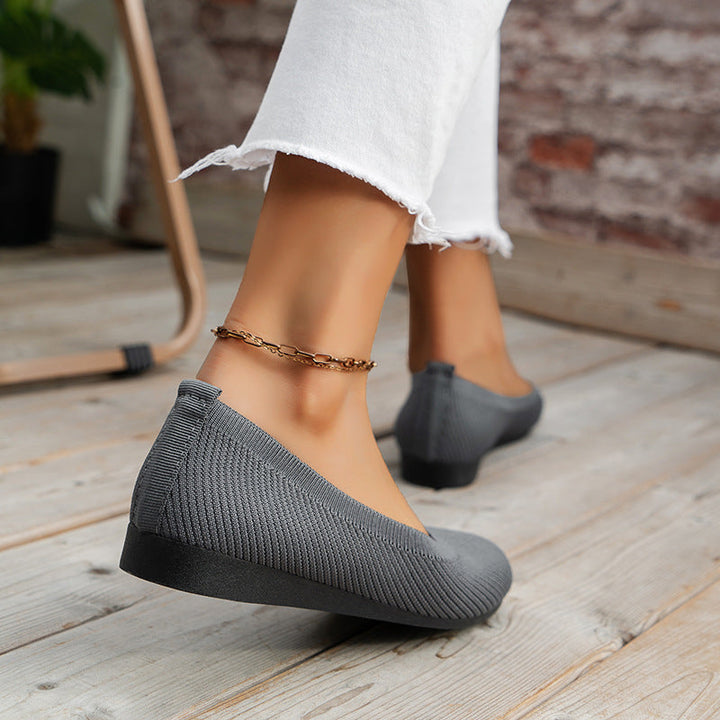 Versatile women's slip-on flats with orthopedic support, suitable for casual & office attire.