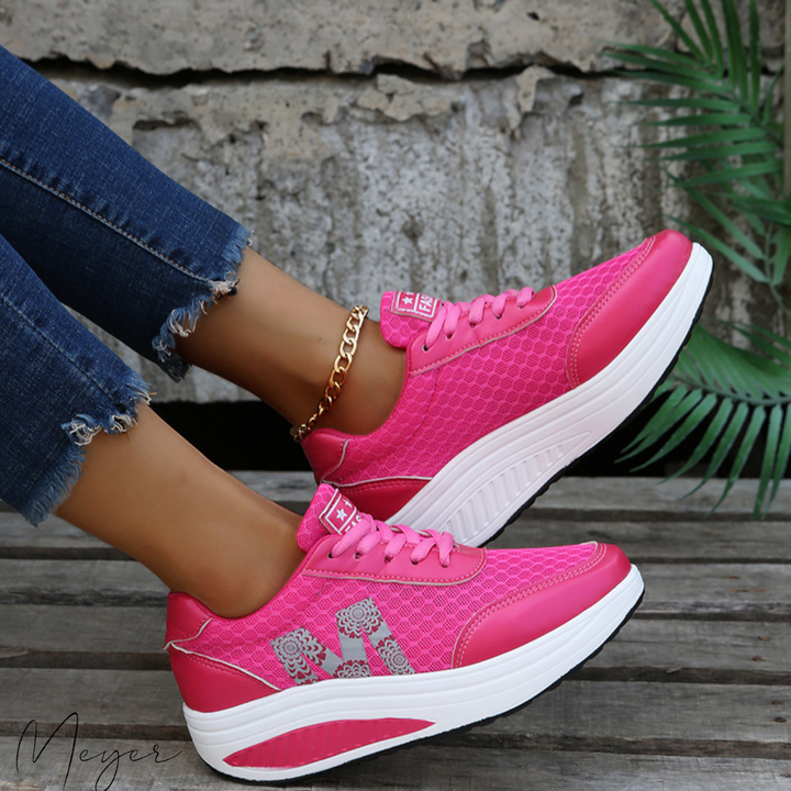 Ladies' casual sneakers with arch support technology, offering comfort footwear for women seeking pain relief.