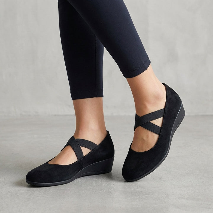 Women's orthopedic criss-cross strap wedge flats, offering comfortable support for everyday wear.