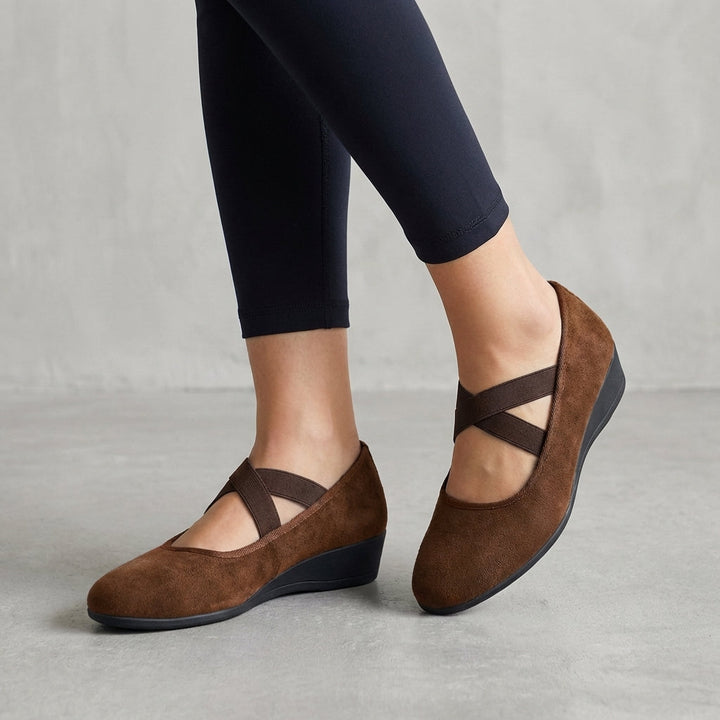 Elegant women's criss-cross wedge sandals, versatile for summer footwear & stylish comfort.