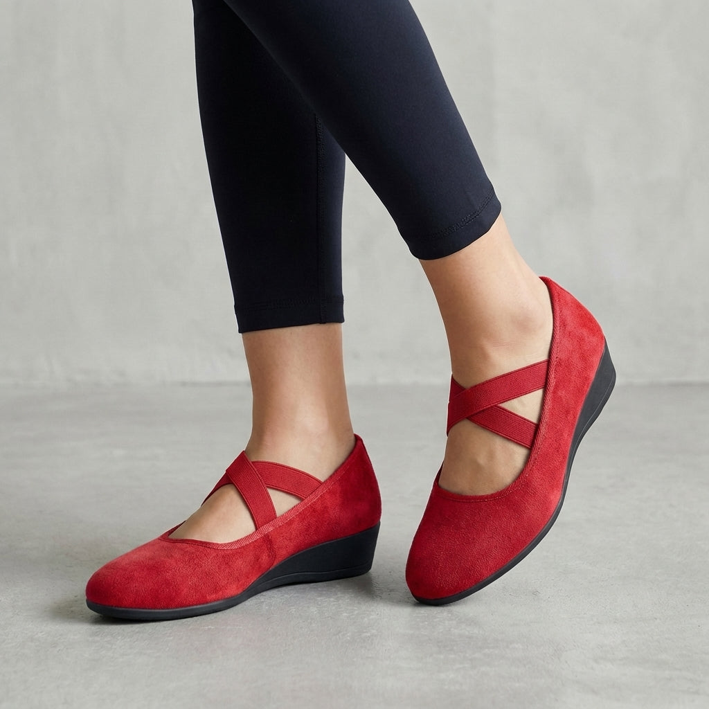 Supportive women's orthopedic flats with stylish criss-cross straps & a comfortable wedge heel.