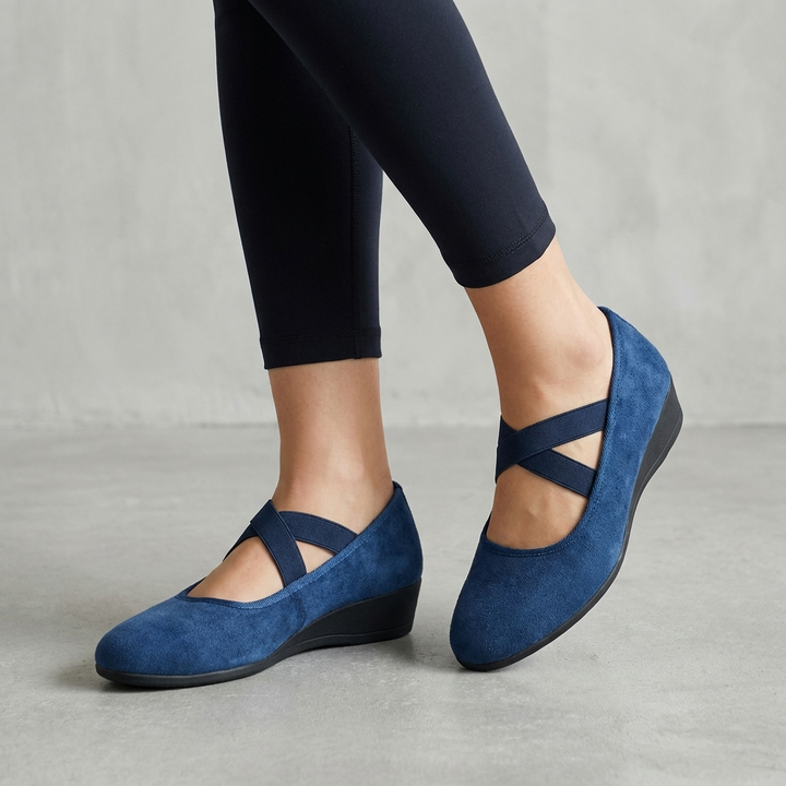 Casual women's criss-cross strap wedge flats, perfect for comfortable summer footwear and everyday style.