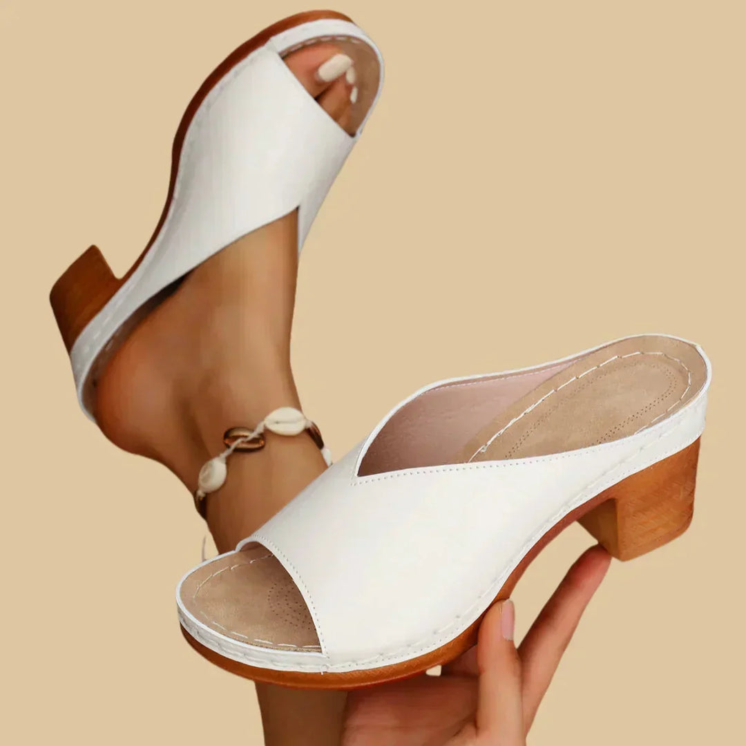 Supportive orthopedic heeled sandals for women featuring arch support and a stable block heel.