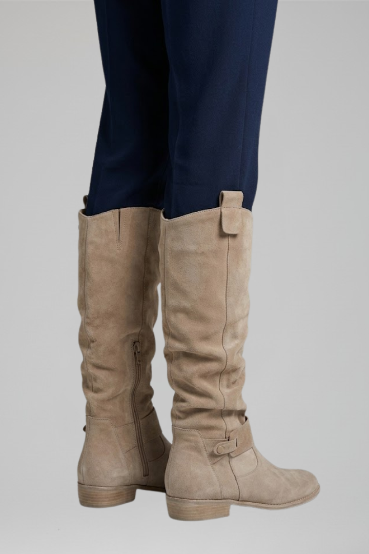 Black knee-high orthopedic boots for women with a side zip, ideal for fall and winter style.