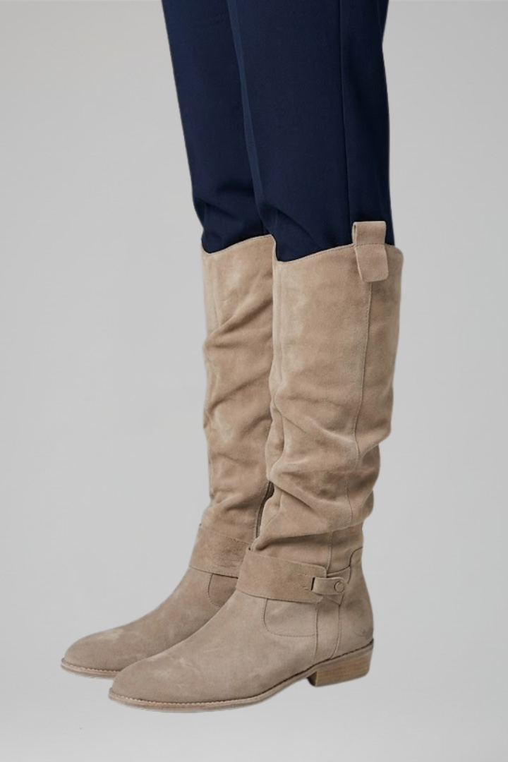 Women's fashionable knee-high boots with orthopedic design, easy side zipper, and rounded toe.