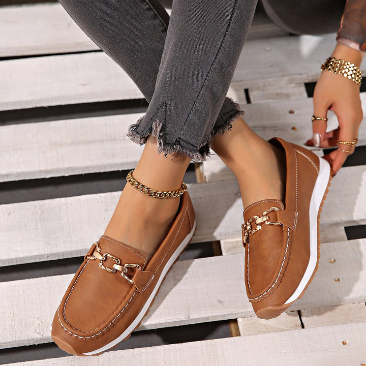 Side view of women's orthopedic loafers, featuring visible arch support & wide toe box for comfort.