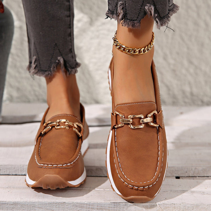 Pair of women's comfortable orthopedic loafers with arch support, ideal for everyday slip-on wear.