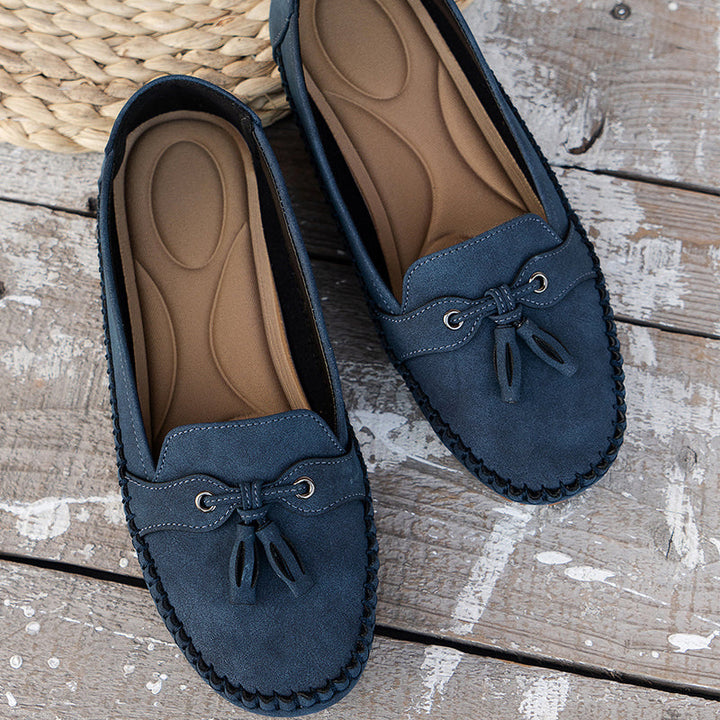 Pair of women's orthopedic loafers, vintage bow design, perfect casual footwear for everyday comfort.