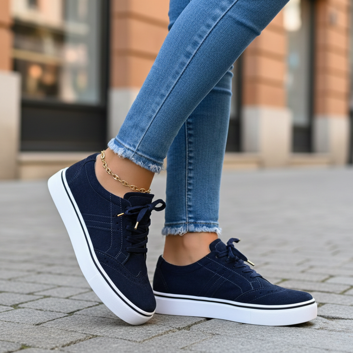 Women's orthopedic low-top sneakers in white, designed for all-day comfort and supportive walking.