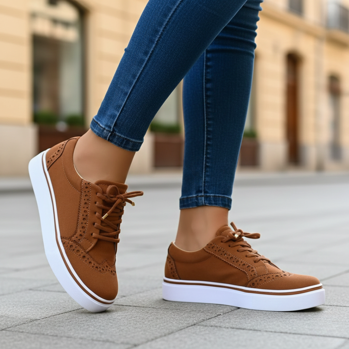 Elegant women's wingtip orthopedic low-top sneakers, offering comfort and stylish support for casual outfits.