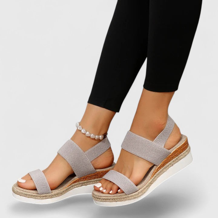 Front view of casual women's slip-on open-toe wedge sandals with supportive orthopedic features.