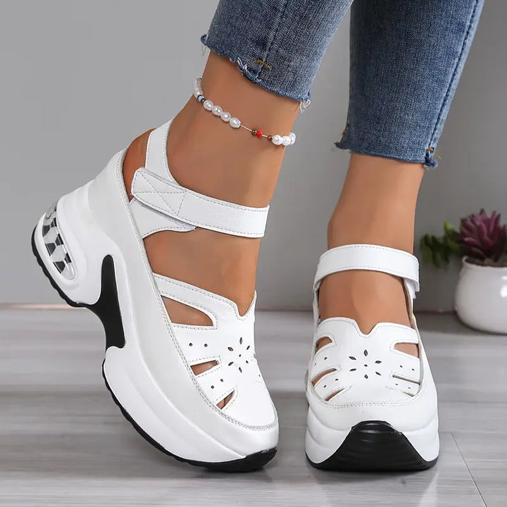 Stylish women's platform wedge sandals with open toe. Casual summer footwear offering orthopedic comfort.