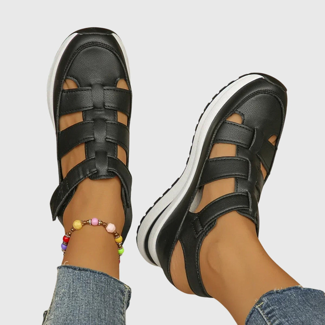 Side view of women's orthopedic sandals featuring adjustable arch support & non-slip sole for walking comfort.
