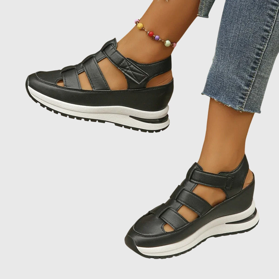 Close-up of the innovative adjustable arch support in women's orthopedic walking sandals for foot comfort.