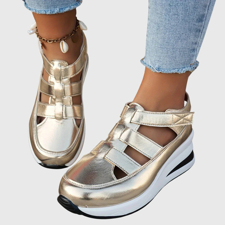 Pair of women's orthopedic sandals, designed with adjustable arch support for comfortable, non-slip walking.