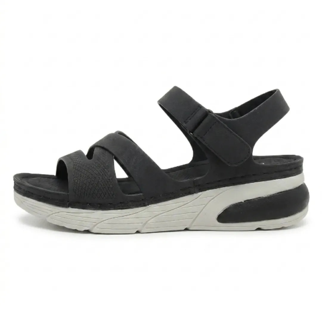 Women's orthopedic sandals with adjustable hook & loop straps, offering arch support & comfort for walking.